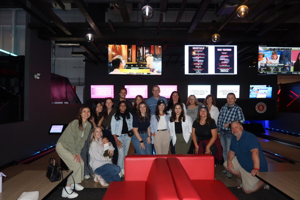 A team photo in front of the bowling alley