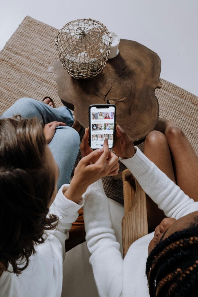 Two people looking at a smartphone